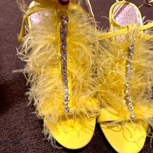 yellow feather, high heels ￼